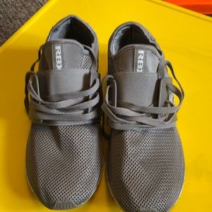 Men’s shoe. New rbx running shoe without tags. Grey body white sole.